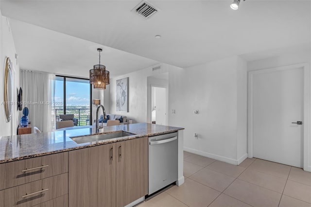 5350 NW 84th Ave Unit 1513, Doral, FL 33166 - kitchen featuring dishwasher, light brown cabinets, stone counters, modern cabinets, and open floor plan
