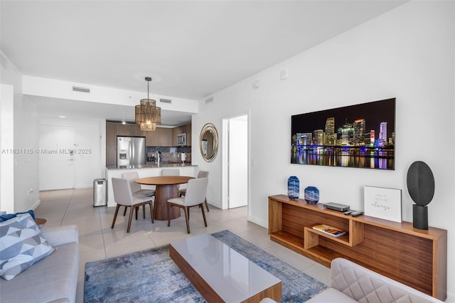 5350 NW 84th Ave Unit 1513, Doral, FL 33166 - living area with light tile patterned floors and a chandelier
