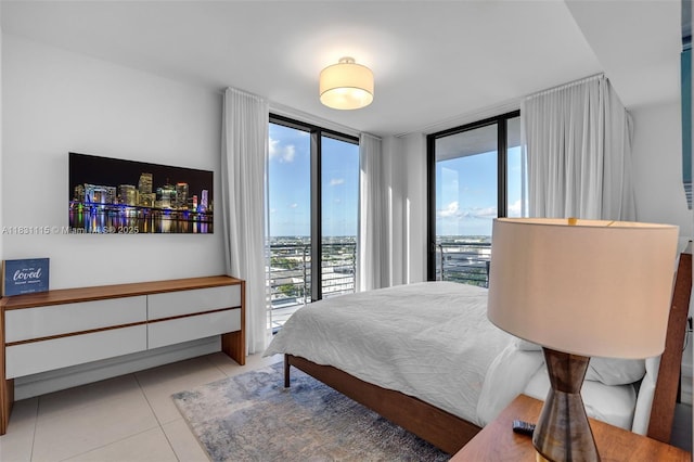 5350 NW 84th Ave Unit 1513, Doral, FL 33166 - bedroom featuring light tile patterned floors, access to exterior, and a wall of windows