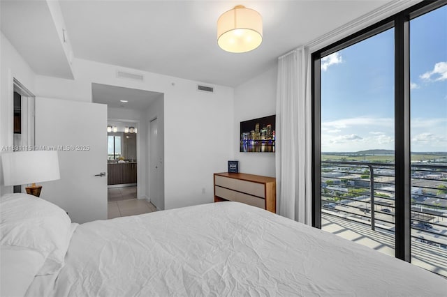 5350 NW 84th Ave Unit 1513, Doral, FL 33166 - bedroom featuring tile patterned flooring and ensuite bath