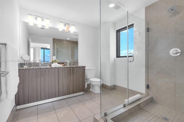 5350 NW 84th Ave Unit 1513, Doral, FL 33166 - bathroom featuring a stall shower, double vanity, and tile patterned floors