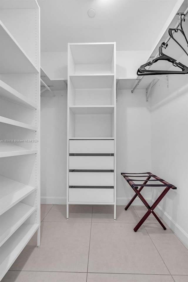5350 NW 84th Ave Unit 1513, Doral, FL 33166 - walk in closet with tile patterned floors