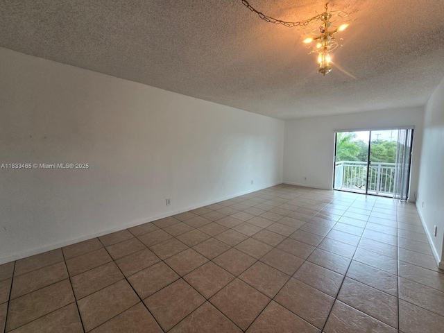 405 S Pine Island Rd Unit 401D, Plantation, FL 33324 - empty room featuring a textured ceiling and tile patterned flooring