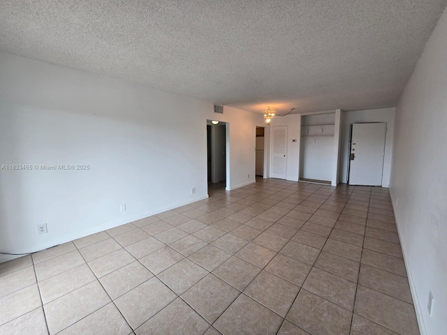 405 S Pine Island Rd Unit 401D, Plantation, FL 33324 - empty room featuring light tile patterned floors and a textured ceiling