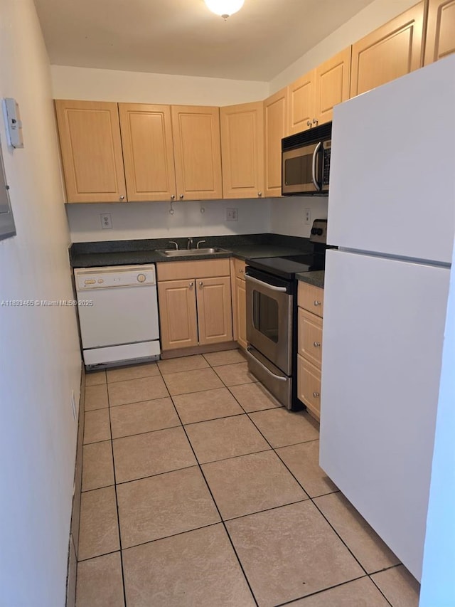 405 S Pine Island Rd Unit 401D, Plantation, FL 33324 - kitchen featuring stainless steel appliances, light brown cabinets, dark countertops, and light tile patterned floors