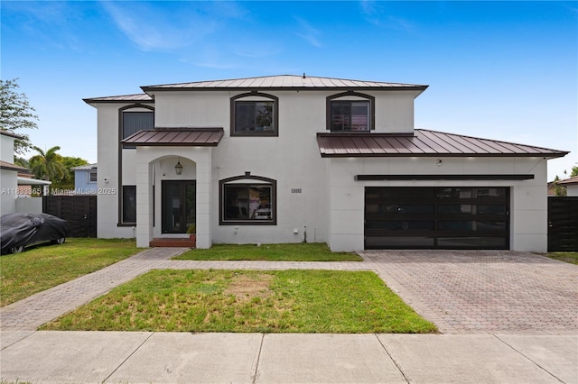 18082 SW 152nd Ct, Miami, FL 33187 - view of front facade with a standing seam roof, a metal roof, stucco siding, and decorative driveway