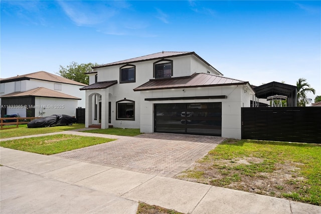 18082 SW 152nd Ct, Miami, FL 33187 - view of front facade with stucco siding, a metal roof, a standing seam roof, decorative driveway, and an attached garage