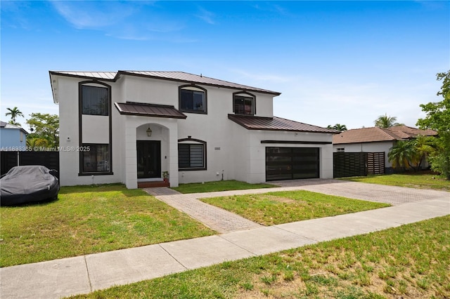 18082 SW 152nd Ct, Miami, FL 33187 - view of front facade with a standing seam roof, driveway, a metal roof, and stucco siding