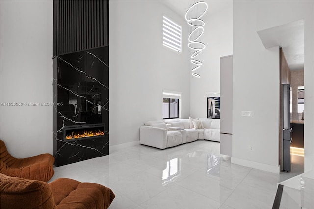 18082 SW 152nd Ct, Miami, FL 33187 - living area with a high ceiling and a premium fireplace