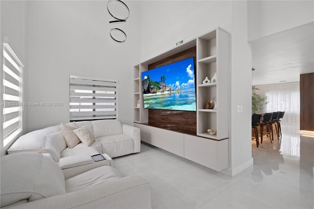 18082 SW 152nd Ct, Miami, FL 33187 - living area featuring a towering ceiling, light tile patterned flooring, and built in features