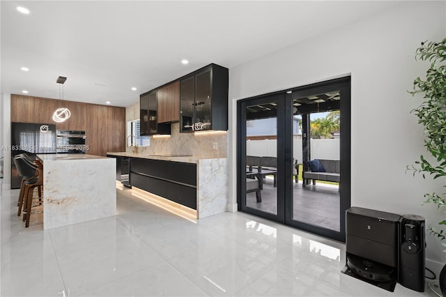 18082 SW 152nd Ct, Miami, FL 33187 - kitchen featuring modern cabinets, recessed lighting, french doors, pendant lighting, and a breakfast bar