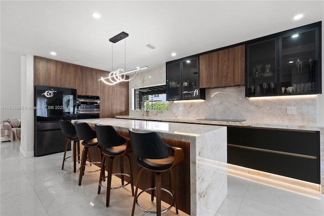 18082 SW 152nd Ct, Miami, FL 33187 - kitchen with smart refrigerator, modern cabinets, tasteful backsplash, a kitchen breakfast bar, and glass insert cabinets