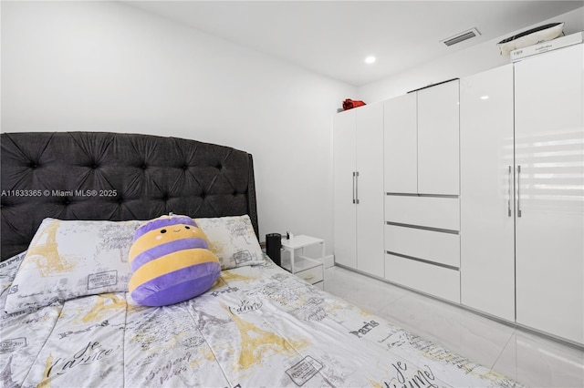 18082 SW 152nd Ct, Miami, FL 33187 - bedroom featuring light tile patterned floors and recessed lighting