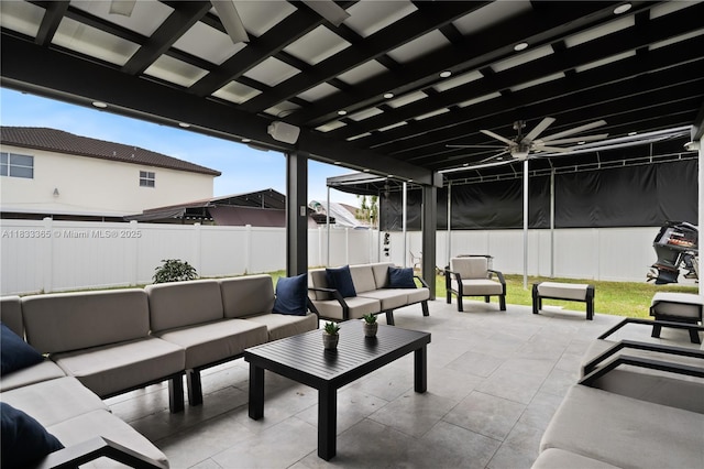 18082 SW 152nd Ct, Miami, FL 33187 - fenced backyard with outdoor lounge area, a patio area, and a ceiling fan