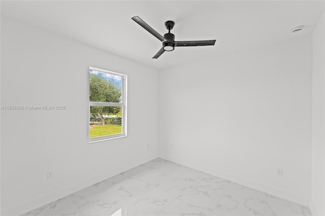 2506 5th St SW, Lehigh Acres, FL 33976 - spare room with light marble finish flooring, a ceiling fan, and a smoke detector