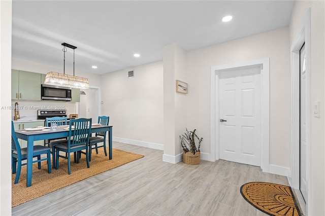 742 NW 70th St, Miami, FL 33150 - dining room with light wood-type flooring and recessed lighting