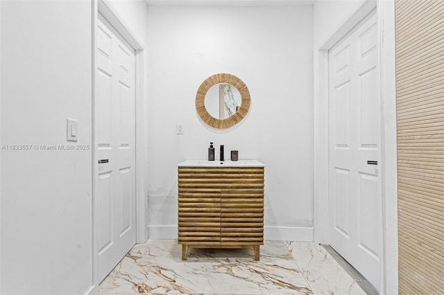 742 NW 70th St, Miami, FL 33150 - bathroom with marble finish flooring, vanity, and a closet