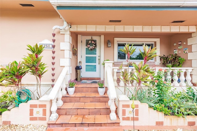 6250 SW 19th St, Miami, FL 33155 - doorway to property featuring a porch and stucco siding