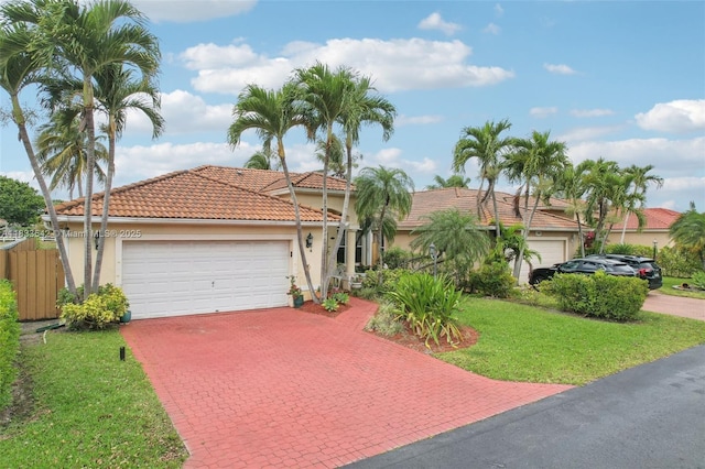 9364 SW 164th Ct, Miami, FL 33196 - view of front of house with stucco siding, driveway, an attached garage, and a tile roof
