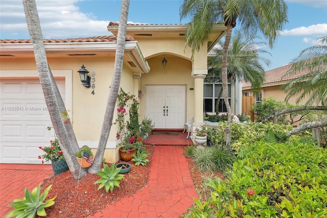 9364 SW 164th Ct, Miami, FL 33196 - property entrance with stucco siding and a tiled roof