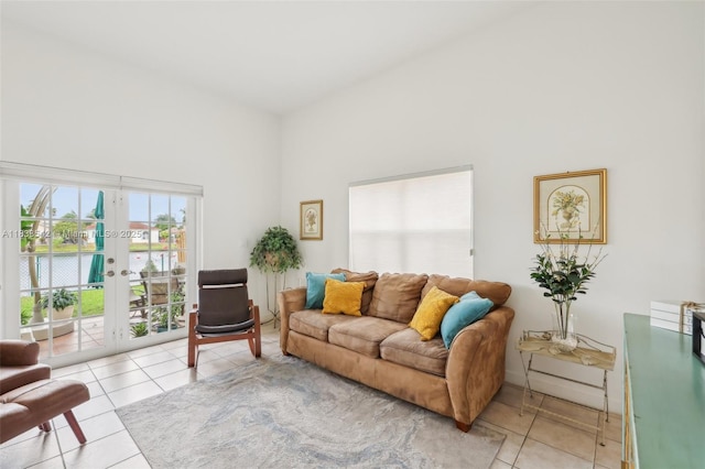 9364 SW 164th Ct, Miami, FL 33196 - living area with light tile patterned flooring, french doors, and a towering ceiling