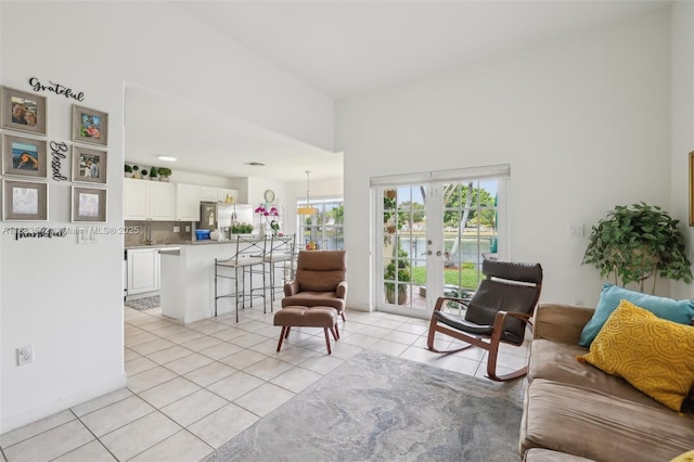 9364 SW 164th Ct, Miami, FL 33196 - living area featuring light tile patterned flooring, french doors, and a towering ceiling