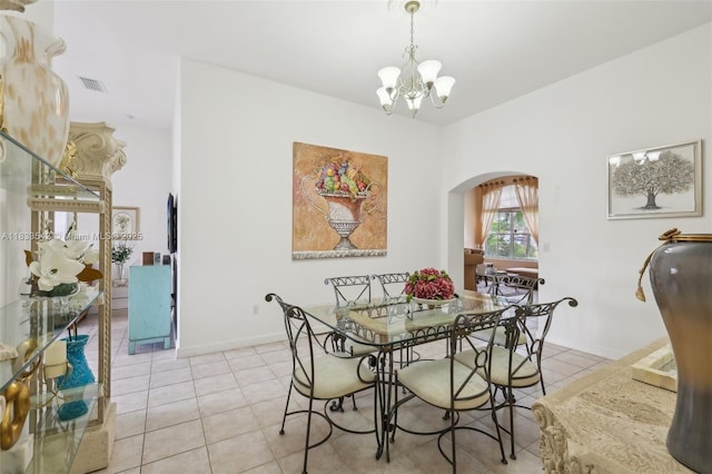 9364 SW 164th Ct, Miami, FL 33196 - dining room featuring arched walkways, a chandelier, and light tile patterned floors