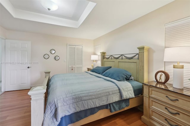 9364 SW 164th Ct, Miami, FL 33196 - bedroom featuring dark wood finished floors, a closet, and a tray ceiling