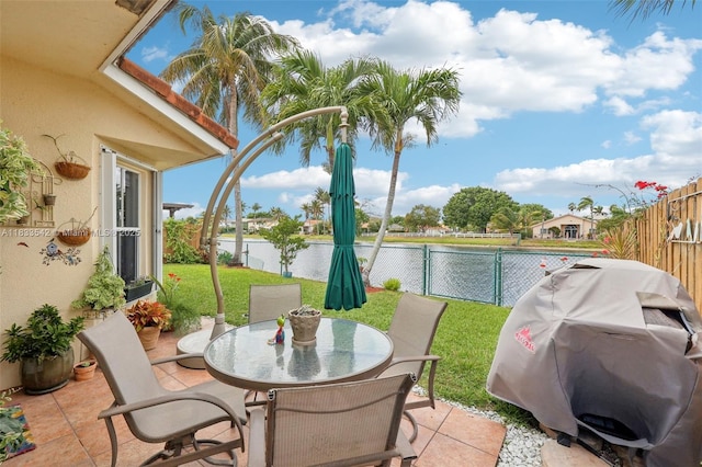 9364 SW 164th Ct, Miami, FL 33196 - fenced backyard with grilling area, a water view, a patio area, and outdoor dining area