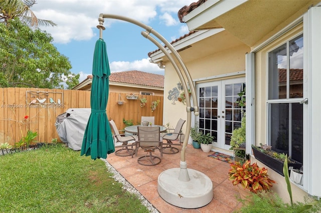 9364 SW 164th Ct, Miami, FL 33196 - view of patio / terrace featuring french doors and a grill