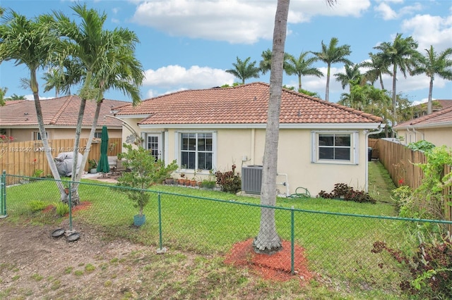 9364 SW 164th Ct, Miami, FL 33196 - rear view of house featuring a tiled roof, stucco siding, and a fenced backyard