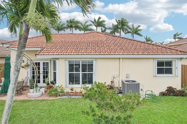 9364 SW 164th Ct, Miami, FL 33196 - back of house with french doors, a yard, and stucco siding