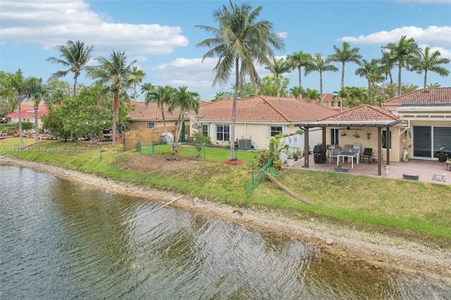 9364 SW 164th Ct, Miami, FL 33196 - back of house with stucco siding, a tile roof, a patio, and a water view