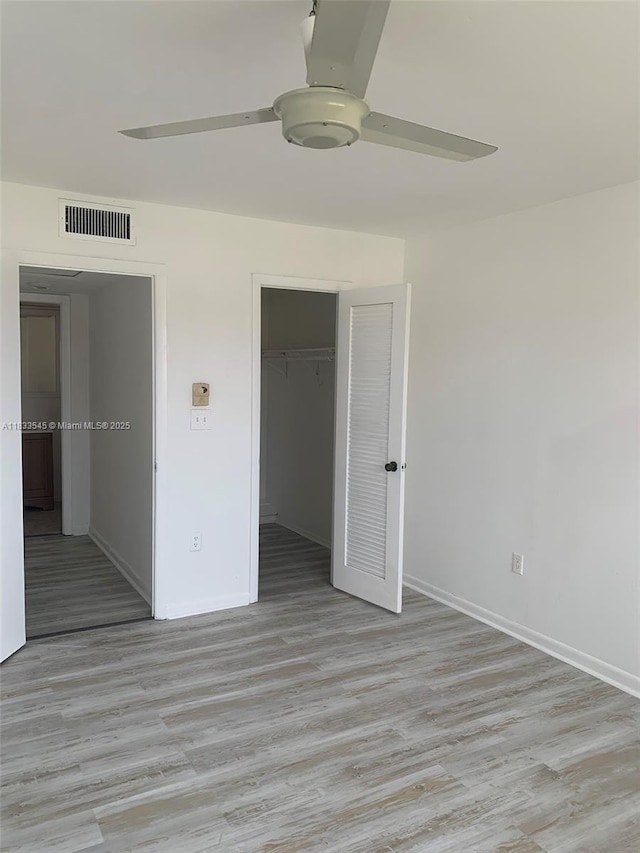 8861 Sunrise Lakes Blvd Unit 307, Sunrise, FL 33322 - unfurnished bedroom featuring light wood-type flooring, a closet, and a ceiling fan