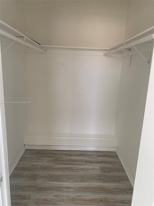 8861 Sunrise Lakes Blvd Unit 307, Sunrise, FL 33322 - spacious closet featuring wood finished floors
