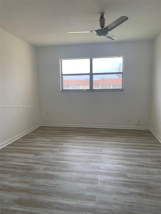 8861 Sunrise Lakes Blvd Unit 307, Sunrise, FL 33322 - unfurnished room featuring a ceiling fan and wood finished floors