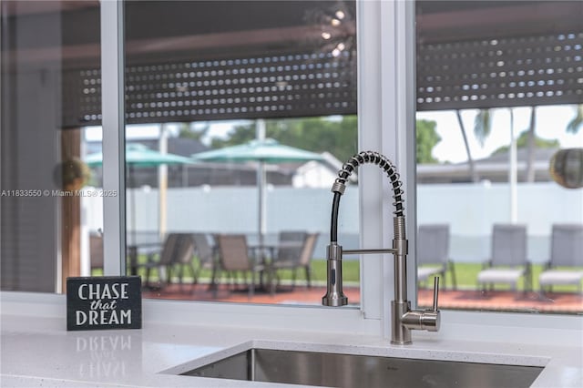 4326 Jackson St, Hollywood, FL 33021 - kitchen view of a sink and light stone counters