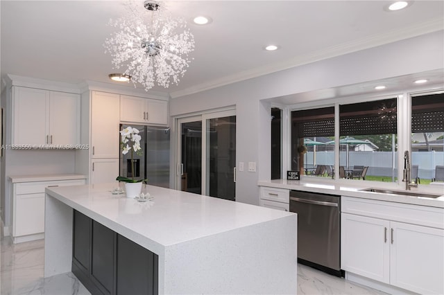 4326 Jackson St, Hollywood, FL 33021 - kitchen featuring appliances with stainless steel finishes, light marble finish flooring, ornamental molding, recessed lighting, and light countertops
