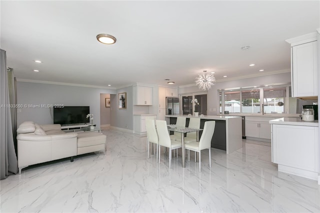 4326 Jackson St, Hollywood, FL 33021 - dining area with recessed lighting, ornamental molding, and light marble finish flooring
