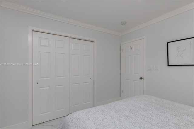 4326 Jackson St, Hollywood, FL 33021 - bedroom featuring crown molding, light marble finish floors, and a closet