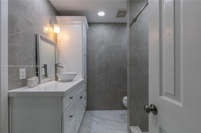 4326 Jackson St, Hollywood, FL 33021 - bathroom with marble look tiles, tile walls, double vanity, a shower, and recessed lighting