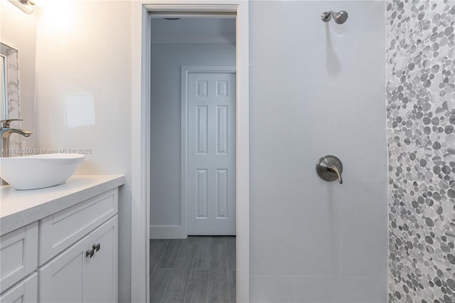 4326 Jackson St, Hollywood, FL 33021 - bathroom featuring a tile shower, vanity, and wood finished floors