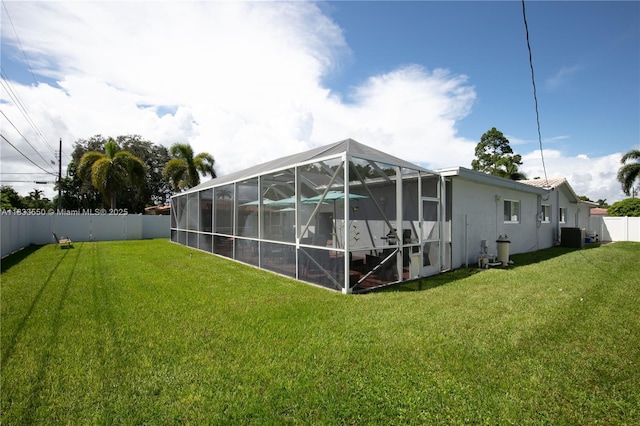 4326 Jackson St, Hollywood, FL 33021 - back of property with a fenced backyard, a lanai, and stucco siding