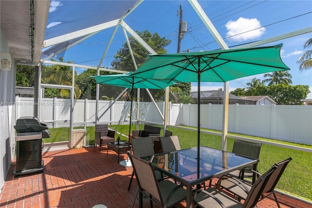 4326 Jackson St, Hollywood, FL 33021 - fenced backyard featuring outdoor dining area, grilling area, a patio area, and a lanai