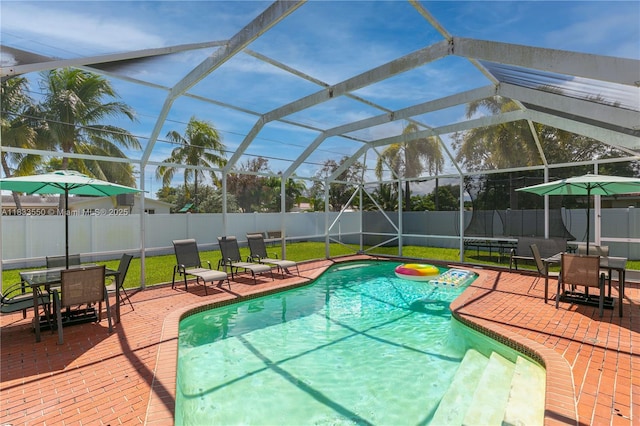 4326 Jackson St, Hollywood, FL 33021 - view of pool featuring a fenced backyard, a patio area, outdoor dining area, and a lanai