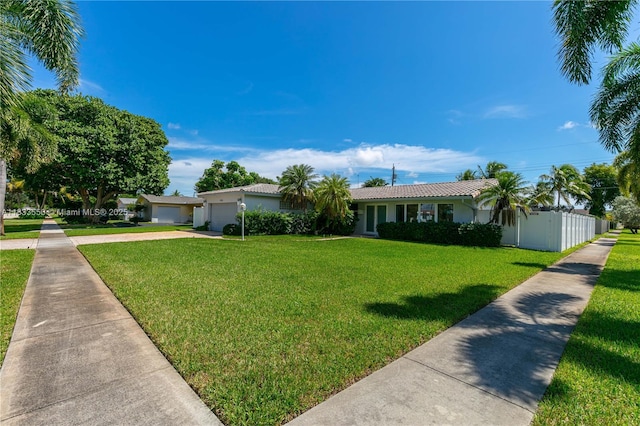 4326 Jackson St, Hollywood, FL 33021 - ranch-style house featuring an attached garage, concrete driveway, stucco siding, and a tiled roof
