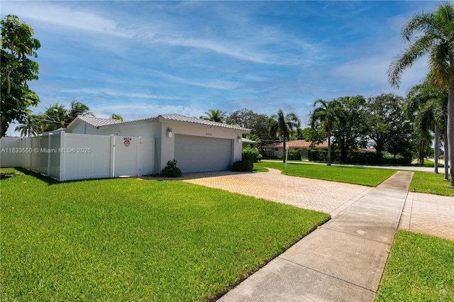 4326 Jackson St, Hollywood, FL 33021 - view of property exterior featuring decorative driveway, an attached garage, stucco siding, and a tile roof