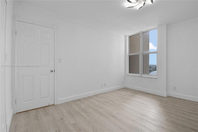 1391 S Ocean Blvd Unit 704, Pompano Beach, FL 33062 - empty room with light wood-style floors