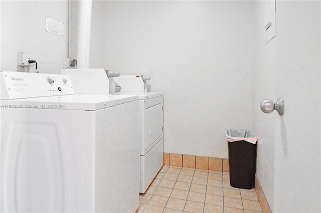 1391 S Ocean Blvd Unit 704, Pompano Beach, FL 33062 - washroom featuring independent washer and dryer and light tile patterned floors