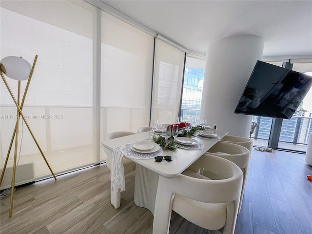 801 S Miami Ave Unit 4204, Miami, FL 33130 - dining space with wood finished floors, plenty of natural light, and floor to ceiling windows